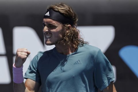 Greece's Stefanos Tsitsipas reacts after winning a point against Italy's Matteo Berrettini during their first round match at the Australian Open tennis championships in Melbourne, Australia, Monday, Jan. 14, 2019. (AP Photo/Mark Schiefelbein)