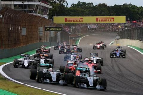SAO PAULO, BRAZIL - NOVEMBER 15:  Nico Rosberg of Germany and Mercedes GP and Lewis Hamilton of Great Britain and Mercedes GP race into the first corner followed by the rest of the field during the Formula One Grand Prix of Brazil at Autodromo Jose Carlos Pace on November 15, 2015 in Sao Paulo, Brazil.  (Photo by Mark Thompson/Getty Images)
