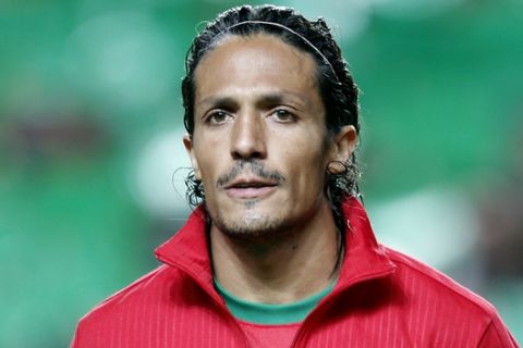 Portugal's Bruno Alves listens to the national anthems prior to a 2014 World Cup first leg qualifying playoff soccer match between Portugal and Sweden at the Luz stadium in Lisbon, Portugal, Friday, Nov. 15, 2013. (AP Photo/Francisco Seco)