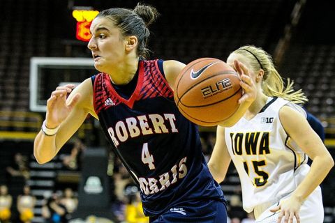 Robert Morris' Anna Niki Stamolamprou (4) drives to the basket against Iowa during the first half of play at Carver-Hawkeye Arena in Iowa City on Sunday, November 15, 2014. (Justin TOrner/Freelance for RMU)