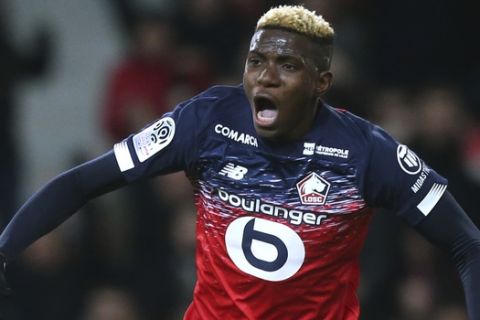 Lille's Victor Osimhen, reacts after the first goal during his French League One soccer match between Lille and Lyon at the Lille Metropole stadium in Villeneuve d'Ascq, northern France, Sunday, March 8, 2020. (AP Photo/Michel Spingler)