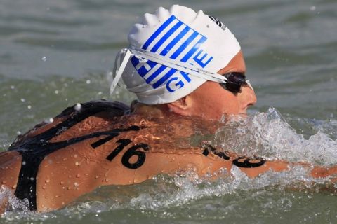 Kalliopi Araouzou of Greece swims on her way to winning the silver medal in the women's 5 km open water race at the European Swimming Championships in Lake Balaton in Balatonfured August 4, 2010. Ekaterina Seliverstova of Russia won the gold medal and Marianna Lymperta of Greece the bronze.  REUTERS/Wolfgang Rattay (HUNGARY - Tags: SPORT SWIMMING)