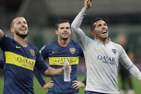 Carlos Tevez of Argentina's Boca Juniors, right, and teammates celebrate their 2-2 draw against Brazil's Palmeiras after a Copa Libertadores second leg semifinal match in Sao Paulo, Brazil, Wednesday, Oct. 31, 2018. Boca advanced to the finals. (AP Photo/Andre Penner)