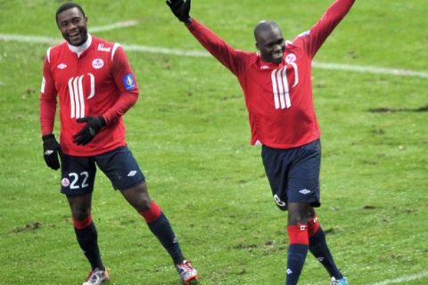 Lille's forward Moussa Sow (R) celebrates after scoring a goal during the French L1 football match Lille vs Lorient on December 05, 2010 at Lille metropole stadium in Villeneuve d'Ascq. AFP PHOTO PHILIPPE HUGUEN (Photo credit should read PHILIPPE HUGUEN/AFP/Getty Images)