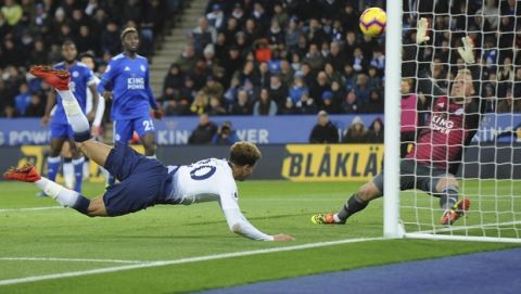 Tottenham's Dele Alli, center, scores his side's second goal during the English Premier League soccer match between Leicester City and Tottenham Hotspur at the King Power Stadium in Leicester, England, Saturday, Dec. 8, 2018. (AP Photo/Rui Vieira)