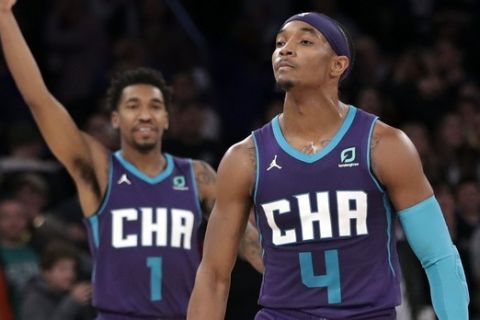 Charlotte Hornets' Devonte' Graham (4) and teammate Malik Monk (1) react after Graham made a 3-point basket during the second half of an NBA basketball game against the New York Knicks, Saturday, Nov. 16, 2019, in New York. The Hornets won 103-102. (AP Photo/Frank Franklin II)