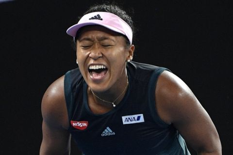 Japan's Naomi Osaka reacts after winning a point against Karolina Pliskova of the Czech Republic during their semifinal at the Australian Open tennis championships in Melbourne, Australia, Thursday, Jan. 24, 2019. (AP Photo/Andy Brownbill)