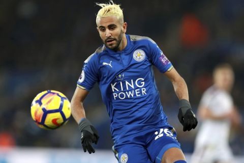 Leicester City's Riyad Mahrez in action during the English Premier League soccer match between Leicester City and Burnley FC at the King Power Stadium. Leicester, England. Saturday. Dec. 2, 2017. (Mike Egerton/PA via AP)