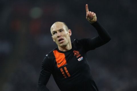 LONDON, ENGLAND - FEBRUARY 29:  Arjen Robben of Netherlands celebrates as he scores their first goal during the international friendly match between England and Netherlands at Wembley Stadium on February 29, 2012 in London, England.  (Photo by Clive Rose/Getty Images)