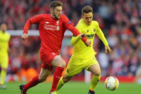 "LIVERPOOL, UNITED KINGDOM - MAY 05:  Adam Lallana of Liverpool and Denis Suarez of Villarreal battle for the ball during the UEFA Europa League semi final second leg match between Liverpool and Villarreal CF at Anfield on May 5, 2016 in Liverpool, England.  (Photo by Richard Heathcote/Getty Images)"