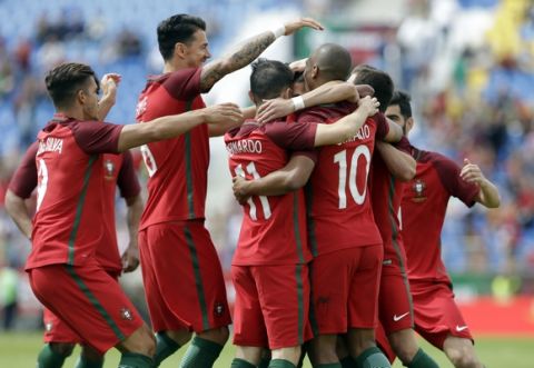 Portugal players celebrate after scoring the opening goal during the international friendly soccer match between Portugal and Cyprus in Estoril, outside Lisbon, Saturday, June 3 2017. (AP Photo/Armando Franca)