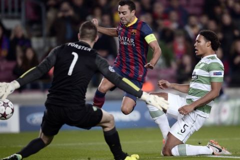 FC Barcelona's Xavi Hernandez, center, duels for the ball with Celtic's Virgil Van Dijk, right, and Fraser Foster during a Champions League soccer match group H at the Camp Nou in Barcelona, Spain, Wednesday, Dec. 11, 2013. (AP Photo/Manu Fernandez)