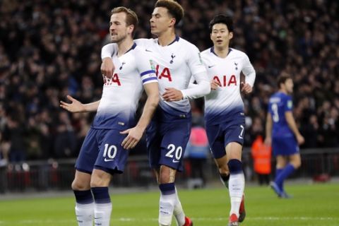 Tottenham's Harry Kane, left, celebrates with teammate Tottenham's Dele Alli after scoring his side first goal during the English League Cup semifinal first leg soccer match between Tottenham Hotspur and Chelsea at Wembley Stadium in London, Tuesday, Jan. 8, 2019. (AP Photo/Frank Augstein)