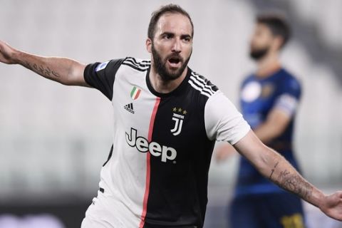 Juventus' Gonzalo Higuain celebrates after a goal during the Serie A soccer match between Juventus and Lecce, at the Allianz Stadium in Turin, Italy, Friday, June 26, 2020. (Fabio Ferrari/LaPresse via AP)