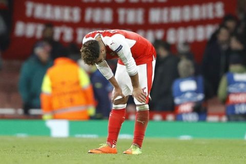 Arsenal's Alex Oxlade-Chamberlain reacts after the Champions League round of 16 second leg soccer match between Arsenal and Bayern Munich at the Emirates Stadium in London, Tuesday, March 7, 2017. Arsenal lost the match 5-1 and 10-2 on aggregate. (AP Photo/Frank Augstein)