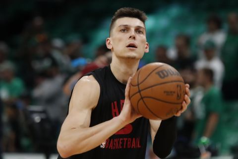 Miami Heat's Tyler Herro warms up before Game 3 of the NBA basketball Eastern Conference finals playoff series against the Boston Celtics, Saturday, May 21, 2022, in Boston. (AP Photo/Michael Dwyer)