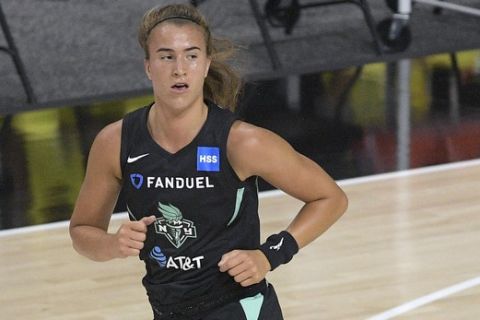 New York Liberty guard Sabrina Ionescu runs up the court after making a basket during the first half of a WNBA basketball game against the Seattle Storm, Saturday, July 25, 2020, in Bradenton, Fla. (AP Photo/Phelan M. Ebenhack)
