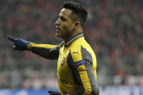 Arsenal's Alexis Sanchez celebrates after scoring his side's opening goal during the Champions League round of 16 first leg soccer match between FC Bayern Munich and Arsenal, in Munich, Germany, Wednesday, Feb. 15, 2017. (AP Photo/Matthias Schrader)