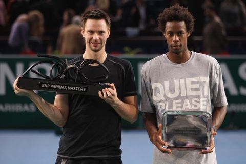 PARIS - NOVEMBER 14:  Robin Soderling (L) of Sweden holds the winners trophy after defeating Gael Monfils (R) of France 6-1,7-6 in the final during Day Eight of the ATP Masters Series Paris at the Palais Omnisports  on November 14, 2010 in Paris, France.  (Photo by Michael Steele/Getty Images)