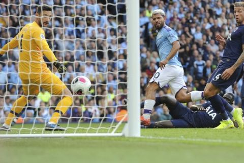 Manchester City's Sergio Aguero, center, scores his side's second goal during the English Premier League soccer match between Manchester City and Tottenham Hotspur at Etihad stadium in Manchester, England, Saturday, Aug. 17, 2019. (AP Photo/Rui Vieira)