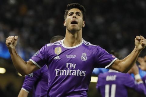 Real Madrid's Marco Asensio celebrates after scoring during the Champions League final soccer match between Juventus and Real Madrid at the Millennium Stadium in Cardiff, Wales, Saturday June 3, 2017. (AP Photo/Kirsty Wigglesworth)