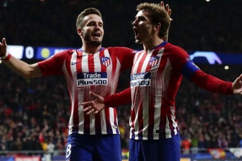 Atletico Antoine Griezmann, right, and Atletico Saul Niguez celebrate after scoring their side's second goal during the Group A Champions League soccer match between Atletico Madrid and Borussia Dortmund at the Wanda Metropolitano stadium in Madrid, Spain, Tuesday, Nov. 6, 2018. (AP Photo/Manu Fernandez)