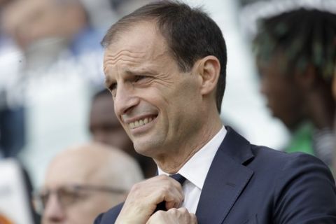 Juventus coach Massimiliano Allegri adjusts his tie prior to the start of a Serie A soccer match between Juventus and AC Fiorentina, at the Allianz stadium in Turin, Italy, Saturday, April 20, 2019. Juventus needs a draw against visiting Fiorentina to clinch a record-extending eighth straight Serie A title. (AP Photo/Luca Bruno)