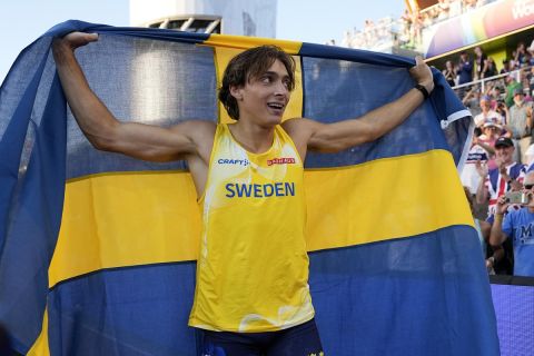Armand Duplantis, of Sweden, celebrates after setting a world record in the men's pole vault final at the World Athletics Championships on Sunday, July 24, 2022, in Eugene, Ore. (AP Photo/Charlie Riedel)
