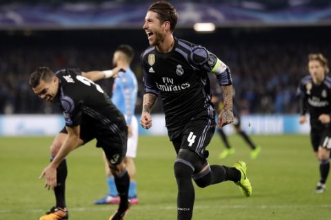 Real Madrid's Sergio Ramos celebrates after scoring his side's second goal during the Champions League round of 16, second leg, soccer match between Napoli and Real Madrid at the San Paolo stadium in Naples, Italy, Tuesday March 7, 2017. (AP Photo/Andrew Medichini)