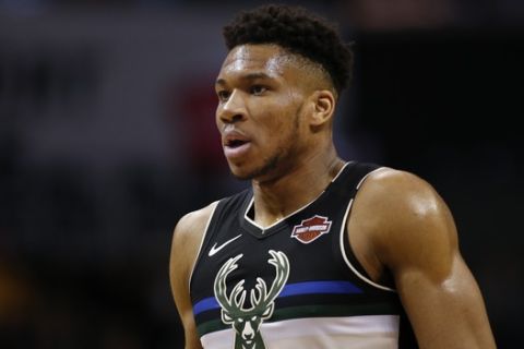 Milwaukee Bucks forward Giannis Antetokounmpo stands on the court in the first half of an NBA basketball game against the Charlotte Hornets in Charlotte, N.C., Sunday, March 1, 2020. Milwaukee won 93-85. (AP Photo/Nell Redmond)