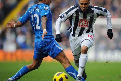 WEST BROMWICH, ENGLAND - DECEMBER 05:  Danny Simpson of Newcastle United tackles Jerome Thomas of West Bromwich Albion during the Barclays Premier League match between West Bromwich Albion and Newcastle United at The Hawthorns on December 5, 2010 in West Bromwich, England.  (Photo by Clive Mason/Getty Images)
