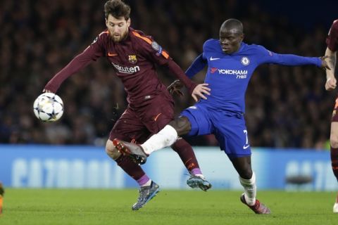 Barcelona's Lionel Messi fights for the ball against Chelsea's N'golo Kante during a Champions League round of sixteen first leg soccer match between FC Barcelona and Chelsea at Stamford Bridge stadium in London, Tuesday, Feb. 20, 2018. (AP Photo/Alastair Grant)