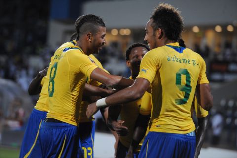 Gabonese players celebrate with teammate Pierre Aubameyang (R) after he scored against Tunisia during their match in the African Cup of Nations in Franceville on January 31, 2012.  AFP PHOTO/PIUS UTOMI EKPEI (Photo credit should read PIUS UTOMI EKPEI/AFP/Getty Images)