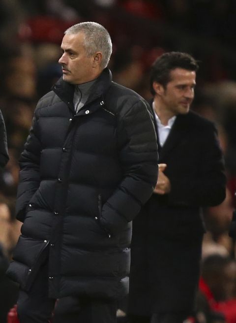 Manchester United manager Jose Mourinho, left and Hull City manager Marco Silva stand, during the English Premier League soccer match between Manchester United and Hull City at Old Trafford in Manchester, England, Wednesday, Feb. 1, 2017. (AP Photo/Dave Thompson)