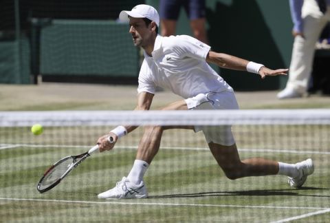 Serbia's Novak Djokovic returns the ball to South Africa's Kevin Anderson during the men's singles final match, at the Wimbledon Tennis Championships, in London, Sunday July 15, 2018.(AP Photo/Kirsty Wigglesworth)