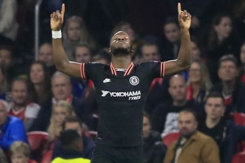 Chelsea's Michy Batshuayi celebrates after scoring his side's opening goal during the group H Champions League soccer match between Ajax and Chelsea at the Johan Cruyff ArenA in Amsterdam, Netherlands, Wednesday, Oct. 23, 2019. (AP Photo/Peter Dejong)