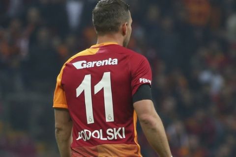 Galatasaray's Lukas Podolski of Germany, wears a black armband for the victims in the attacks on Saturday prior to a Turkish championship soccer match against Gaziantep, in Istanbul, Sunday, Dec. 11, 2016. Turkey declared a national day of mourning, launched a full investigation and paid tribute to the dead Sunday after two bombings outside the Besiktas football club stadium in Istanbul, following a soccer match on Saturday night, killed dozens of people and wounded scores of others others. Turkish authorities have banned distribution of images relating to the Istanbul explosions within Turkey. (AP Photo)