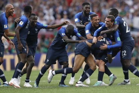 French players celebrate at the end of the final match between France and Croatia at the 2018 soccer World Cup in the Luzhniki Stadium in Moscow, Russia, Sunday, July 15, 2018. France won 4-2. (AP Photo/Petr David Josek)