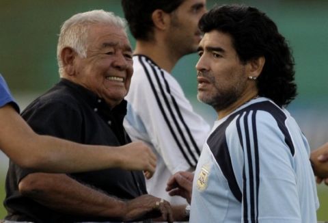 Argentina's coach Diego Armando Maradona, right, gestures in front of his father, Diego Maradona, during training session in Buenos Aires, Thursday, March 26, 2009. Argentina will face Venezuela in a 2010 World Cup qualifying soccer match next March 28. (AP Photo/Natacha Pisarenko)