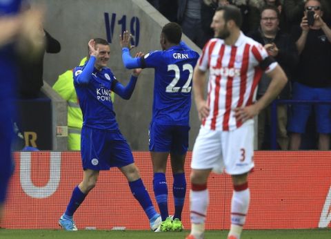 Leicester City's Jamie Vardy celebrates scoring his sides second goal against Stoke City, during their English Premier League soccer match at the King Power Stadium in Leicester, England, Saturday April 1, 2017. (Nigel French/PA via AP)