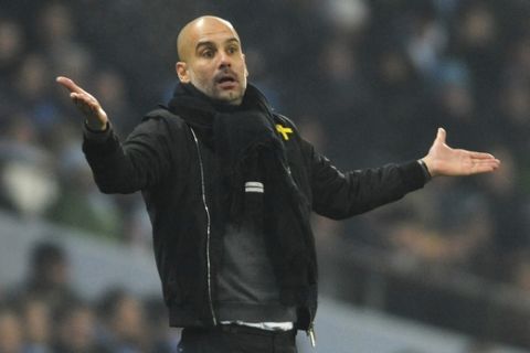 Manchester City manager Josep Guardiola during the English Premier League soccer match between Manchester City and Tottenham Hotspur at Etihad stadium, in Manchester, England, Saturday, Dec. 16, 2017. (AP Photo/Rui Vieira)