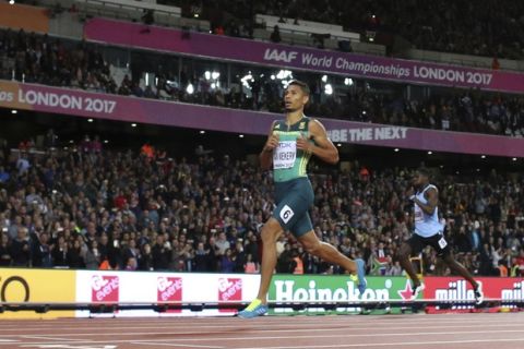 South Africa's Wayde Van Niekerk crosses the line to win the gold medal in the men's 400-meter final during the World Athletics Championships in London Tuesday, Aug. 8, 2017. (AP Photo/Matthias Schrader)