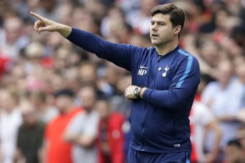 Tottenham manager Mauricio Pochettino gestures during the English FA Cup semifinal soccer match between Manchester United and Tottenham Hotspur at Wembley stadium in London, Saturday, April 21, 2018. (AP Photo/Kirsty Wigglesworth)