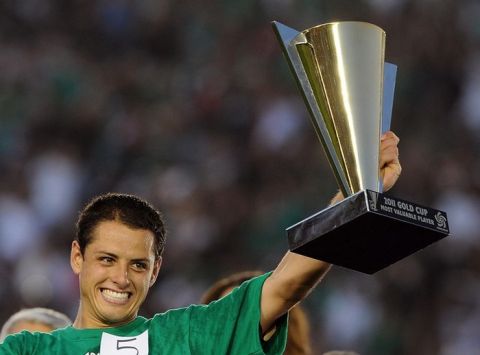 Mexico's Javier Hernandez holds his most valuable player trophy after the CONCACAF 2011 Gold Cup final match United States against Mexico on June 25, 2011 at the Rose Bowl in Pasadena, California. AFP PHOTO / GABRIEL BOUYS (Photo credit should read GABRIEL BOUYS/AFP/Getty Images)