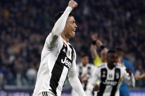 Juventus' Cristiano Ronaldo celebrates after scoring his side's second goal during the Champions League round of 16, 2nd leg, soccer match between Juventus and Atletico Madrid at the Allianz stadium in Turin, Italy, Tuesday, March 12, 2019. (AP Photo/Antonio Calanni)