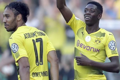 Dortmund's Ousmane Dembele, right, celebrates after scoring the opening goal during the German soccer cup final match between Borussia Dortmund and Eintracht Frankfurt in Berlin, Germany, Saturday, May 27, 2017. (AP Photo/Michael Sohn)