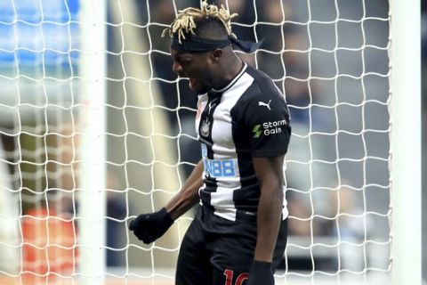 Newcastle United's Allan Saint-Maximin reacts after a missed chance on goal, during the English Premier League soccer match between Newcastle and Bournemouth, at St James' Park, in Newcastle, England, Saturday Nov. 9, 2019. (Owen Humphreys/PA via AP)
