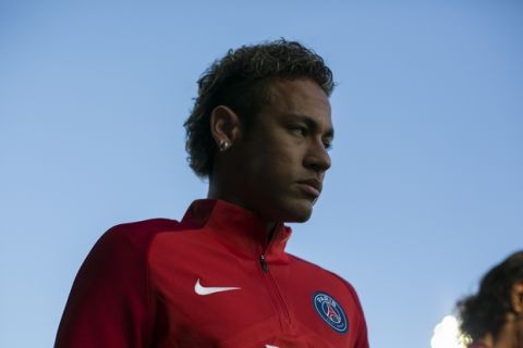 PSG's Neymar is pictured on the pitch ahead his French League One soccer match against Guingamp at the Roudourou stadium in Guingamp, western France, Sunday, Aug. 13, 2017. Neymar makes his long-awaited debut with Paris Saint-Germain on Sunday in the small Brittany town of Guingamp. French soccer authorities finally receive the Brazil star's international transfer certificate. (AP Photo/Kamil Zihnioglu)