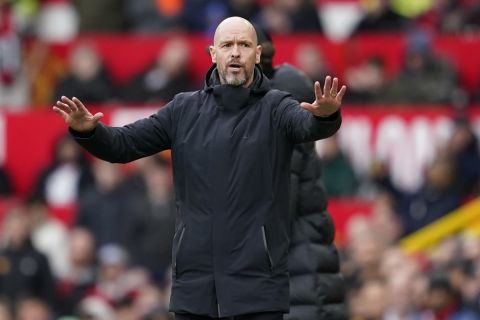 Manchester United's head coach Erik ten Hag gestures during the English Premier League soccer match between Manchester United and Liverpool at the Old Trafford stadium in Manchester, England, Sunday, April 7, 2024. (AP Photo/Dave Thompson)