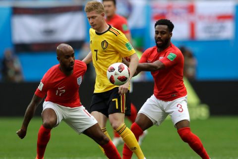 Belgium's Kevin De Bruyne, center, is challenged by England's Fabian Delph, left, and England's Danny Rose during the third place match between England and Belgium at the 2018 soccer World Cup in the St. Petersburg Stadium in St. Petersburg, Russia, Saturday, July 14, 2018. (AP Photo/Petr David Josek)